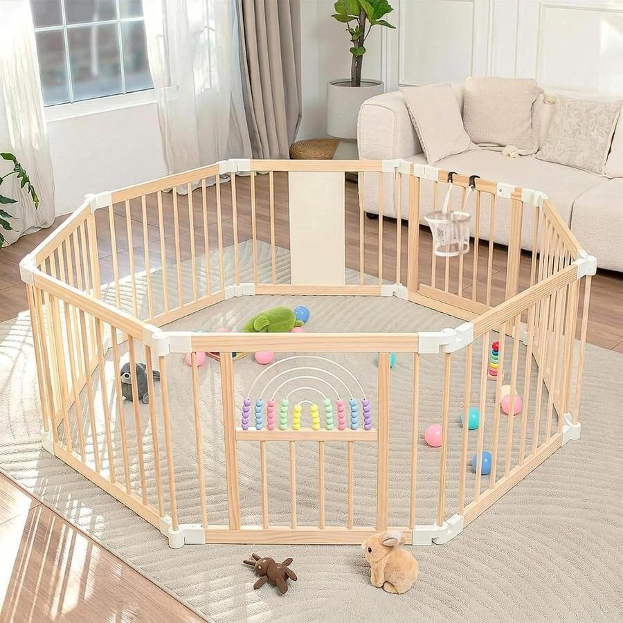 Smooth pine top rail of the Ulnxiy wooden playpen with even wood grain visible